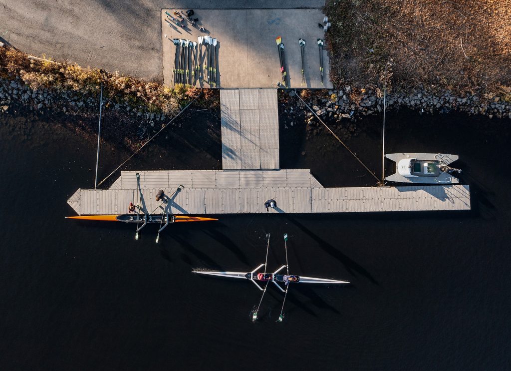 2 doubles push off from the dock